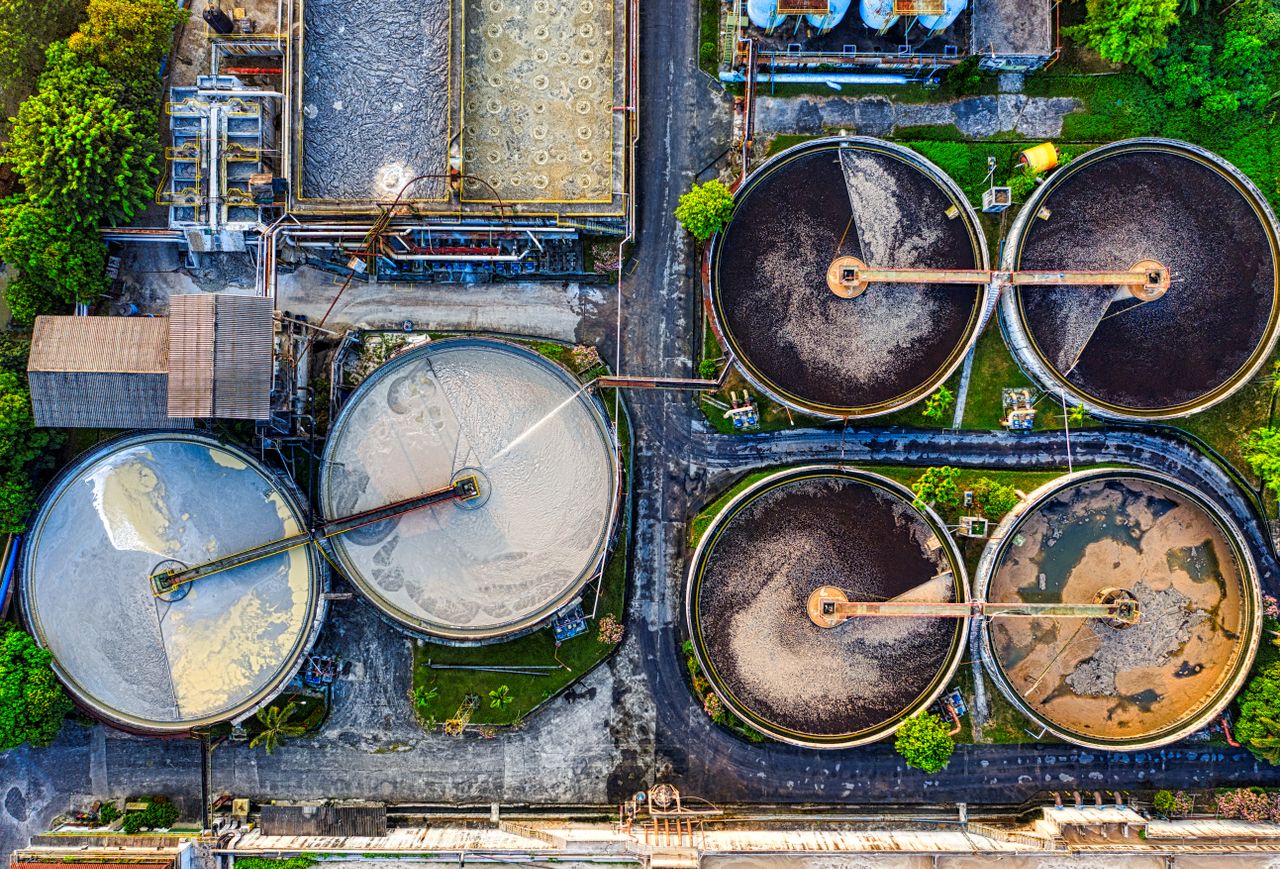 Home Top-down view of a water treatment plant in an industrial area of Indonesia.